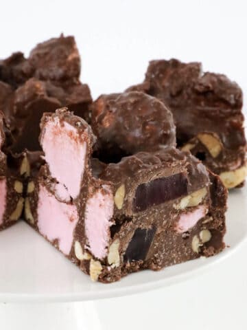 Pieces of rocky road on a cake stand.