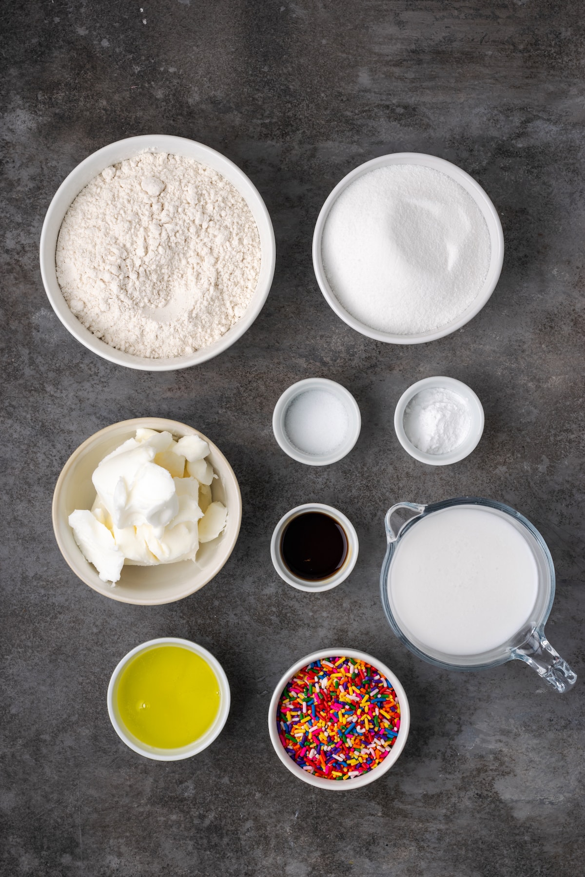This is the best confetti cake recipe made from fluffy white cake loaded with rainbow sprinkles. Even better than a boxed Funfetti cake mix! The ingredients for confetti cake.