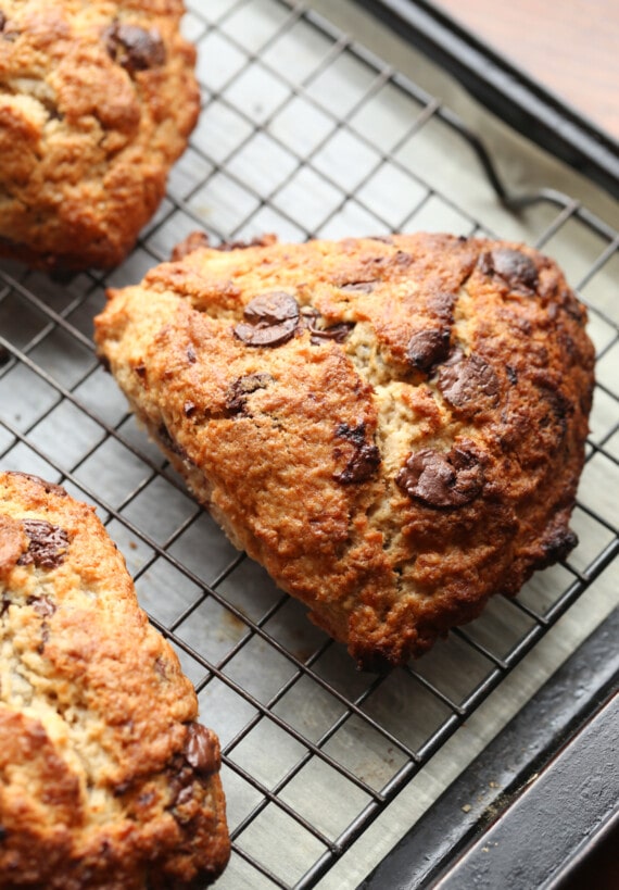 A banana scone on a wire rack cooling