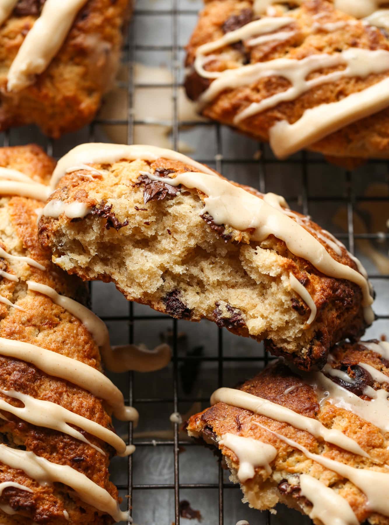 These Chocolate Chip Banana Scones have perfectly crisp, buttery edges with a fluffy, yet flaky, soft center making this the perfect scone recipe! Banana Scone broken in half with flaky layers