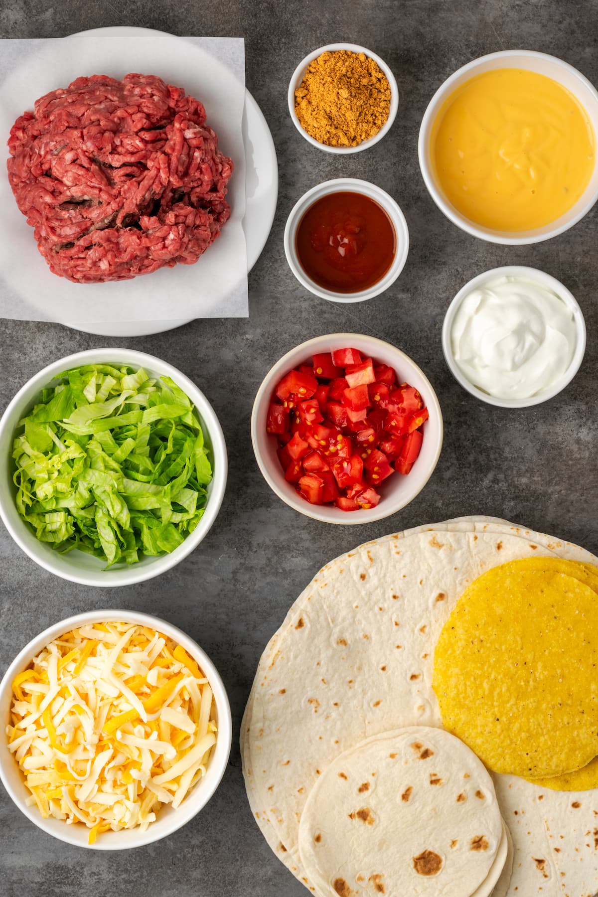 Make satisfying crunch wraps loaded with taco meat, melty cheese, tostada, sour cream, and more wrapped up inside a toasty flour tortilla! Ingredients for homemade crunch wraps.