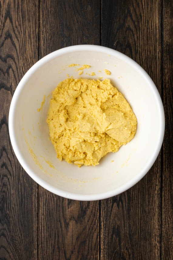 Crispy hot water cornbread is totally crave-worthy! Fried cornbread is an easy side dish to pair with your favorite Southern meals. Cornbread dough in a mixing bowl.