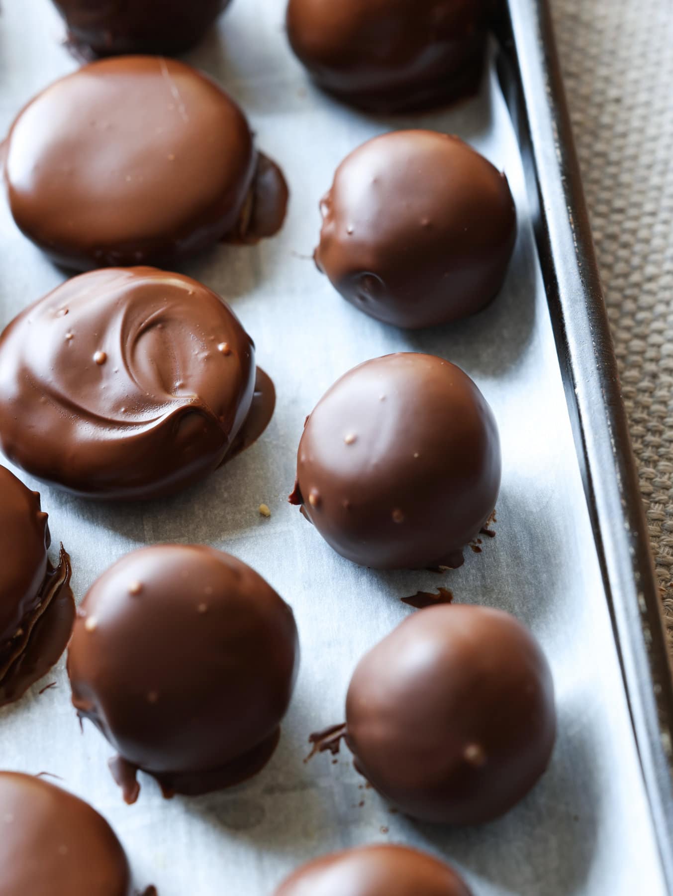 Chocolate set on a peanut butter truffle after being coated.