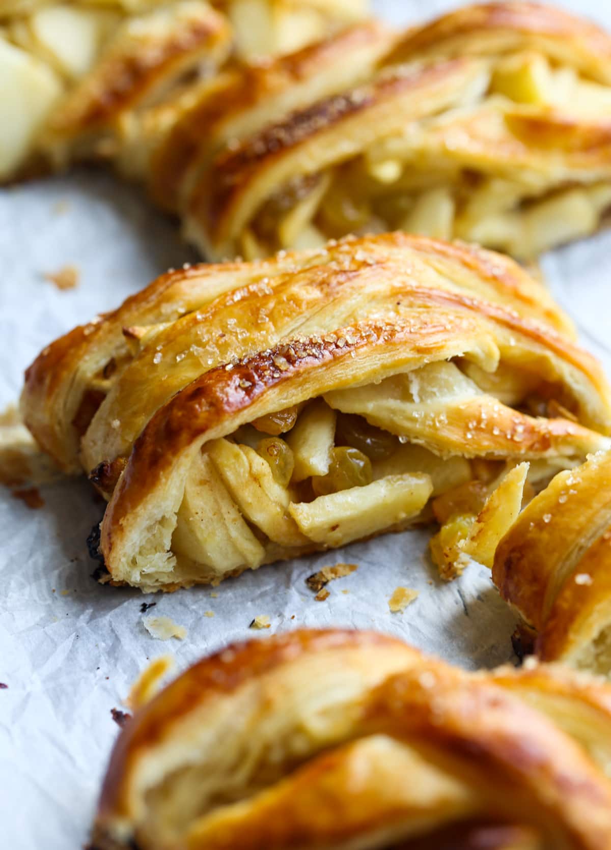 This easy Apple Strudel recipe is filled with cinnamon, brown sugar, raisins and more! It's a crispy, flaky pastry that's easy to make and downright delicious. A slice of Apple Strudel with Golden Raisins