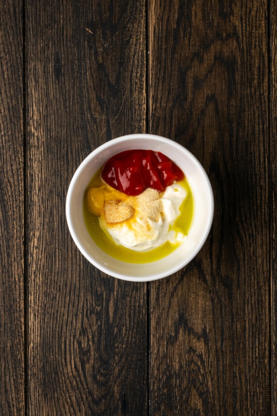 The ingredients for the burger sauce combined in a white bowl.