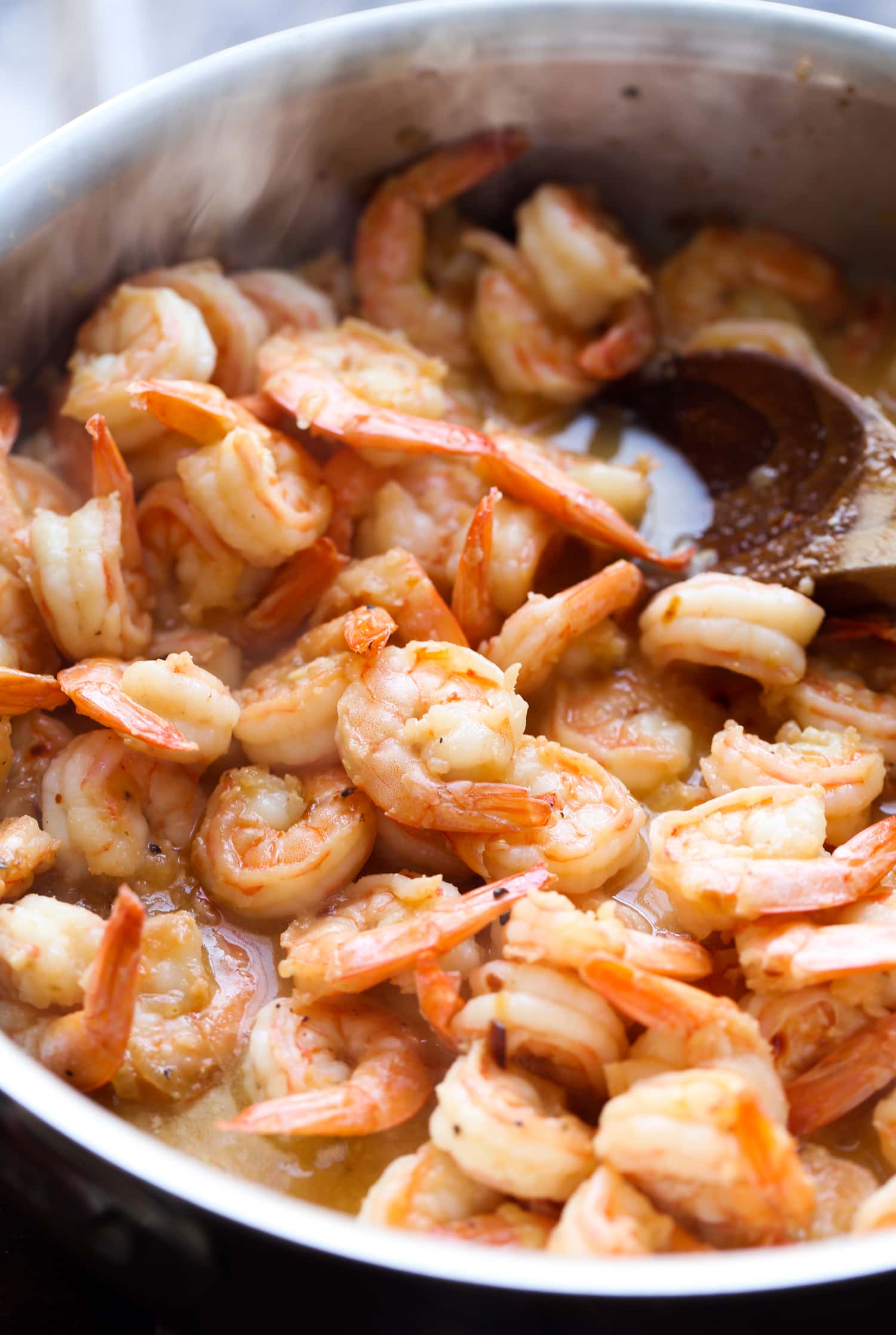 This classic shrimp scampi recipe is INSANELY delicious! Buttery, garlicky sauce with perfectly cooked shrimp and linguine pasta. So good! Shrimp cooked in a butter sauce.