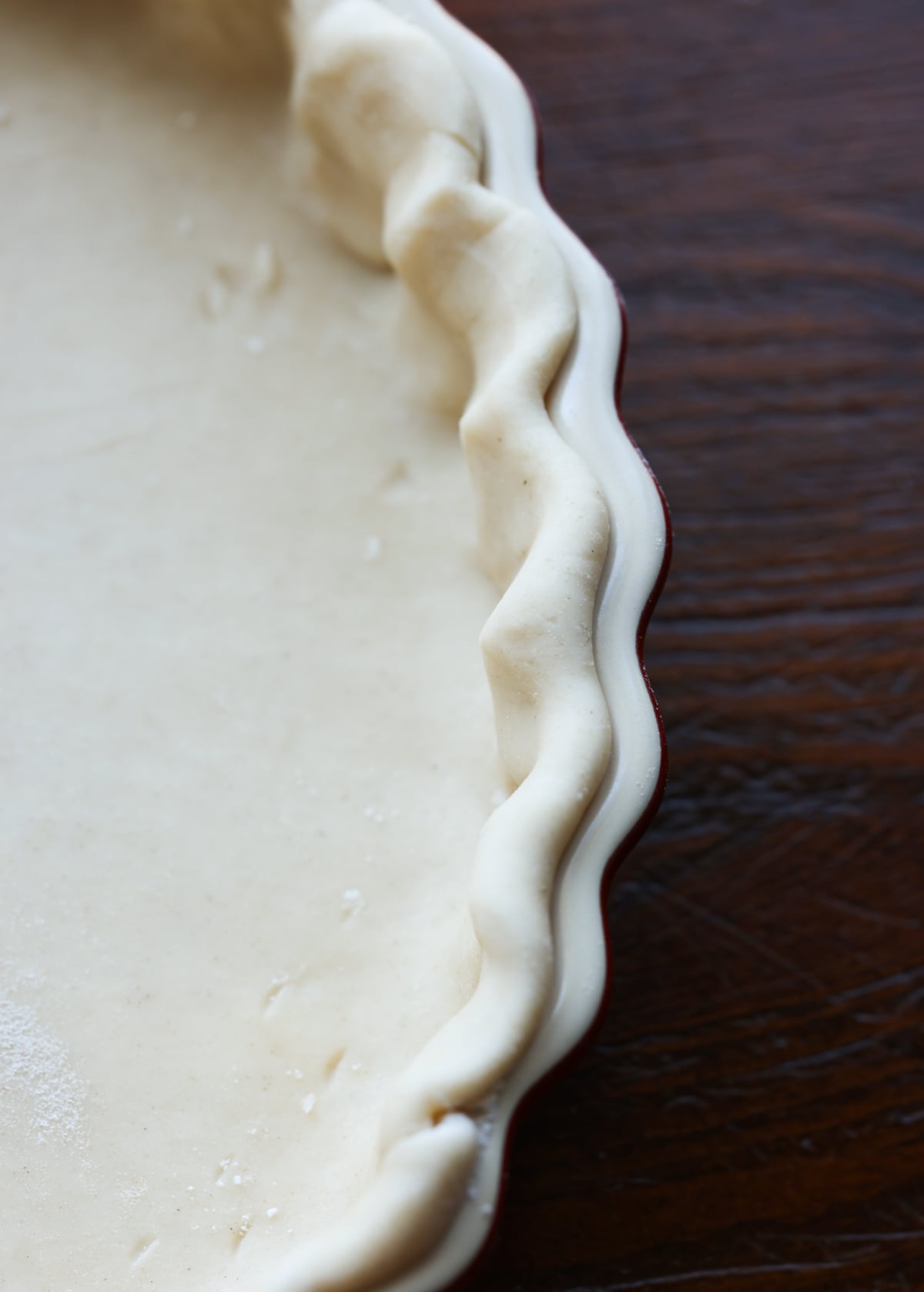 pie dough in a tart pan fluted at the edge