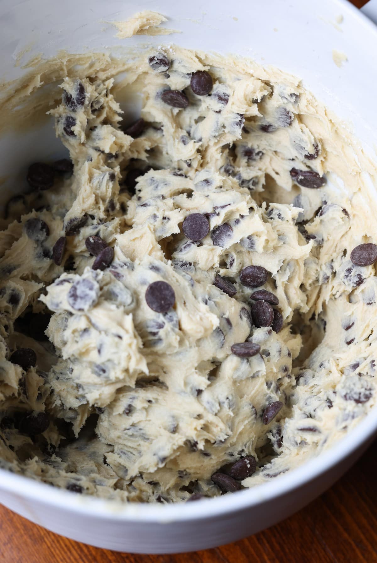chocolate chip cookie dough in a white mixing bowl