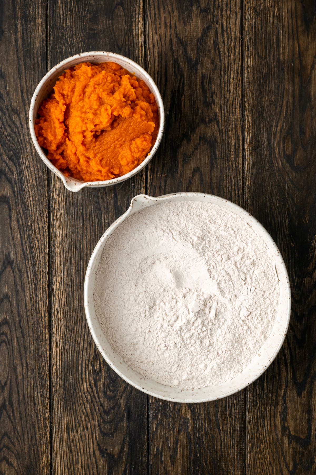 These soft and fluffy pumpkin cookies with cake mix are an easy fall dessert, made with only 2 ingredients and ready for the oven in minutes! The two ingredients for pumpkin cookies with cake mix.