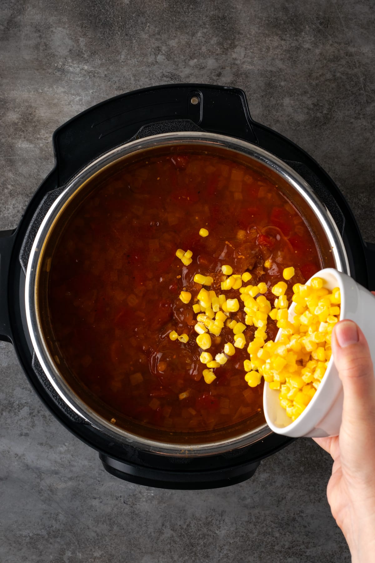 Smoky and flavorful Instant Pot chicken tortilla soup is a comforting one-pot meal that's easy to make any night of the week! Sweet corn kernels are added to tortilla soup in the Instant Pot.
