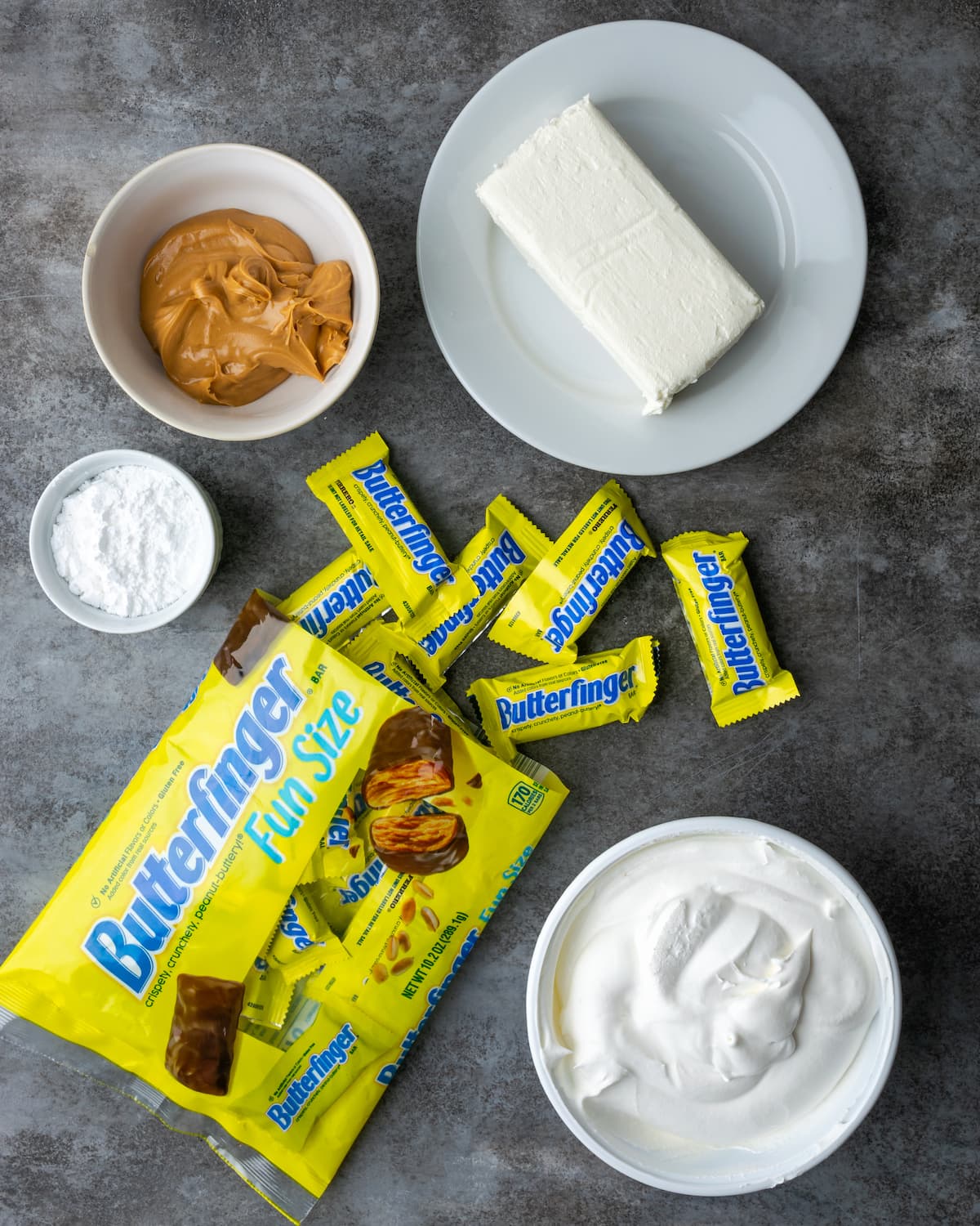 Creamy Butterfinger Pie is an easy dessert recipe that's loaded with Butterfinger candy bars! Treat yourself to this tasty peanut butter pie! The ingredients for Butterfinger pie.
