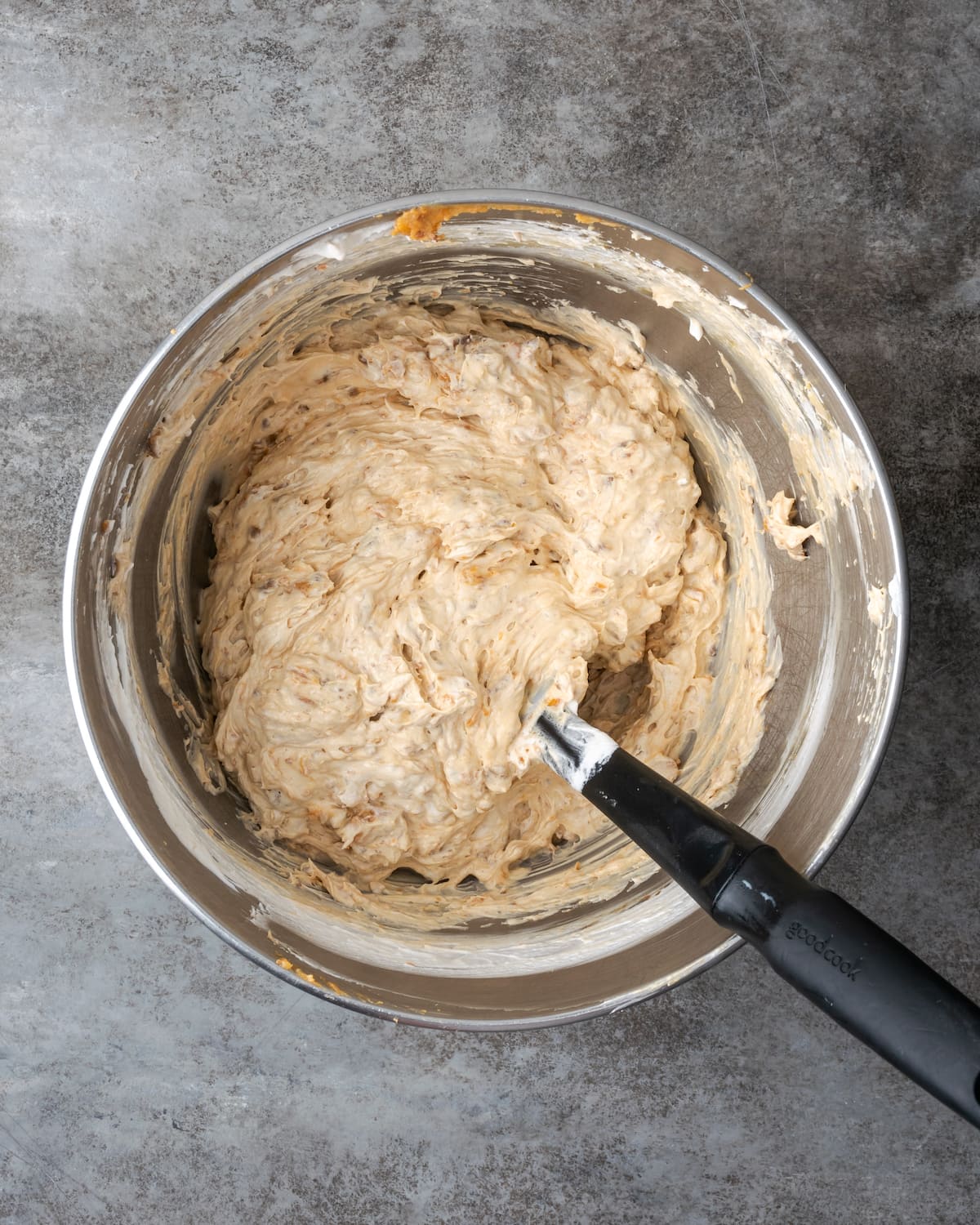 Creamy Butterfinger Pie is an easy dessert recipe that's loaded with Butterfinger candy bars! Treat yourself to this tasty peanut butter pie! Butterfinger pie filling in a large mixing bowl.