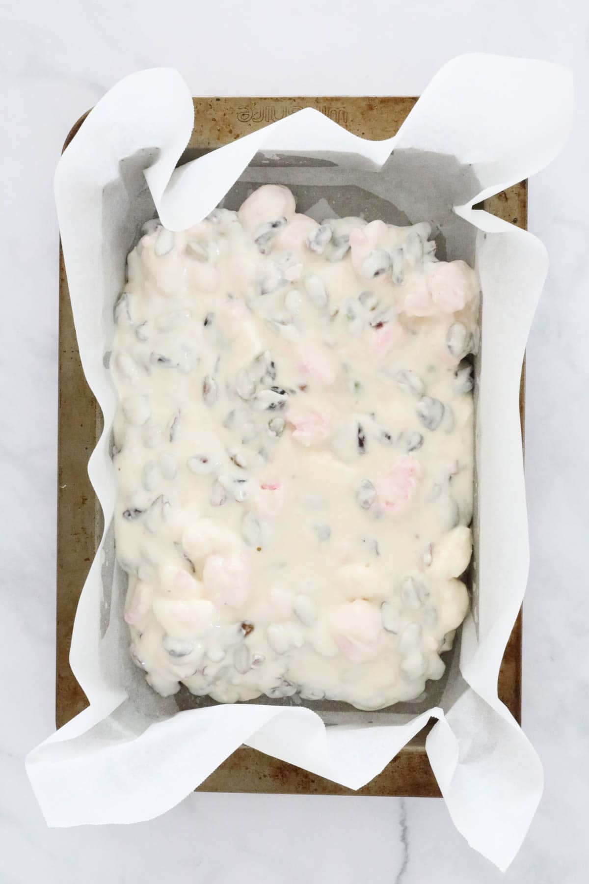 A white chocolate rocky road in a tin.
