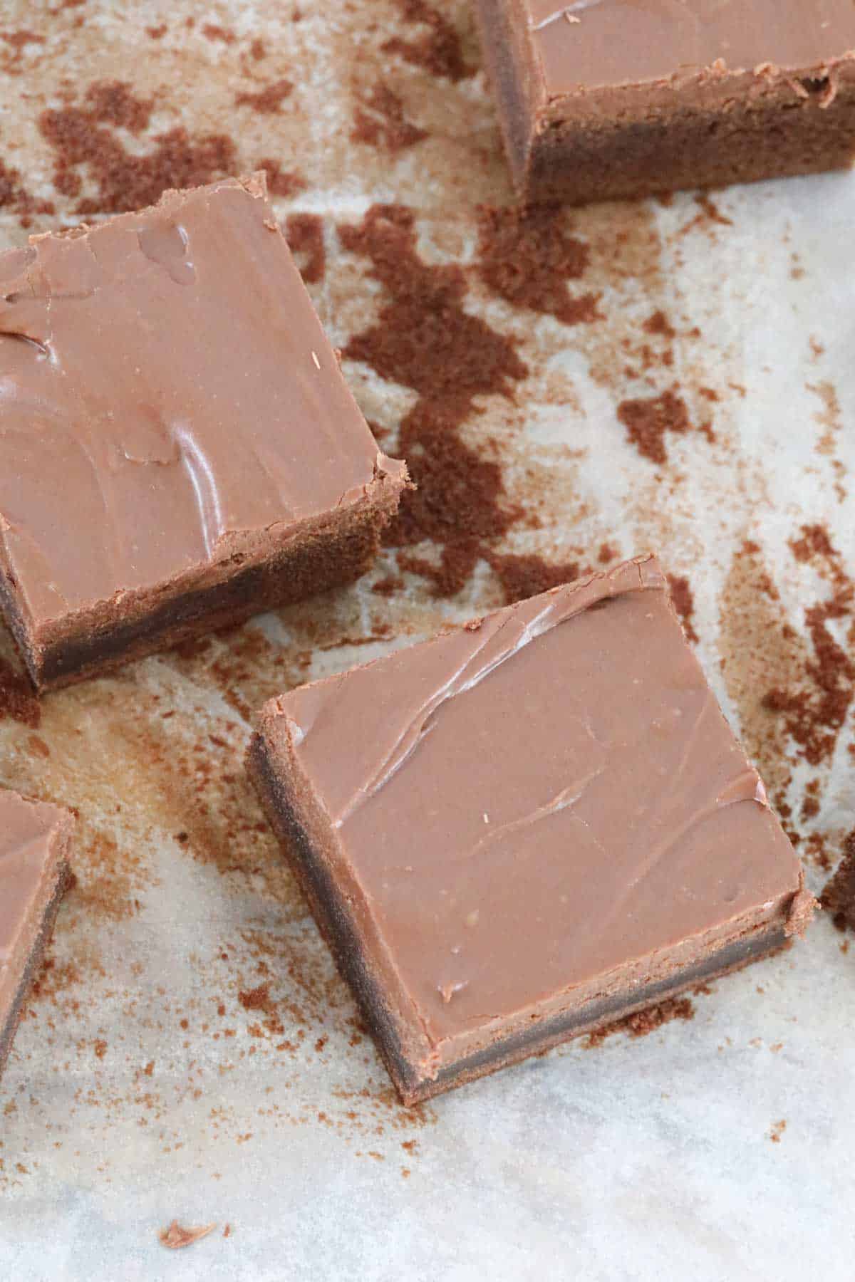 Brownie being cut up on a board.