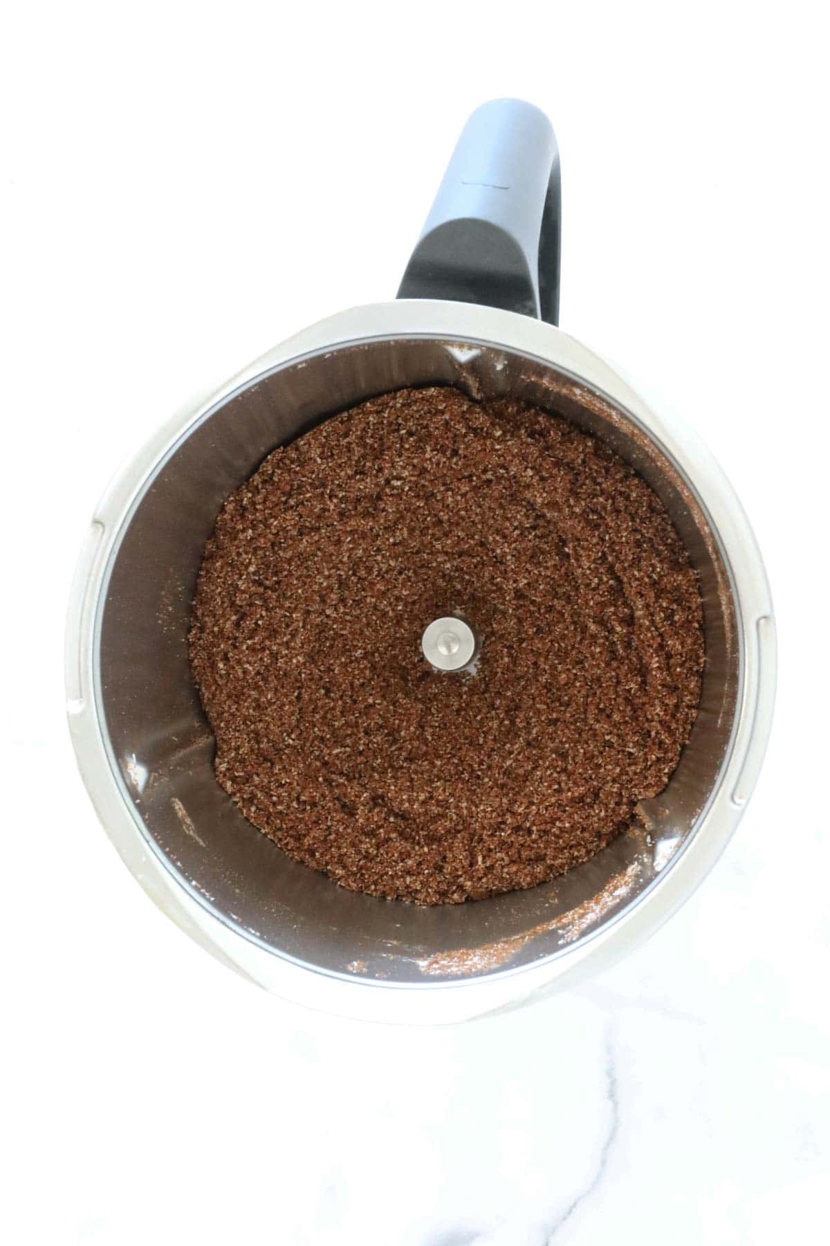 Crushed biscuits in a Thermomix.