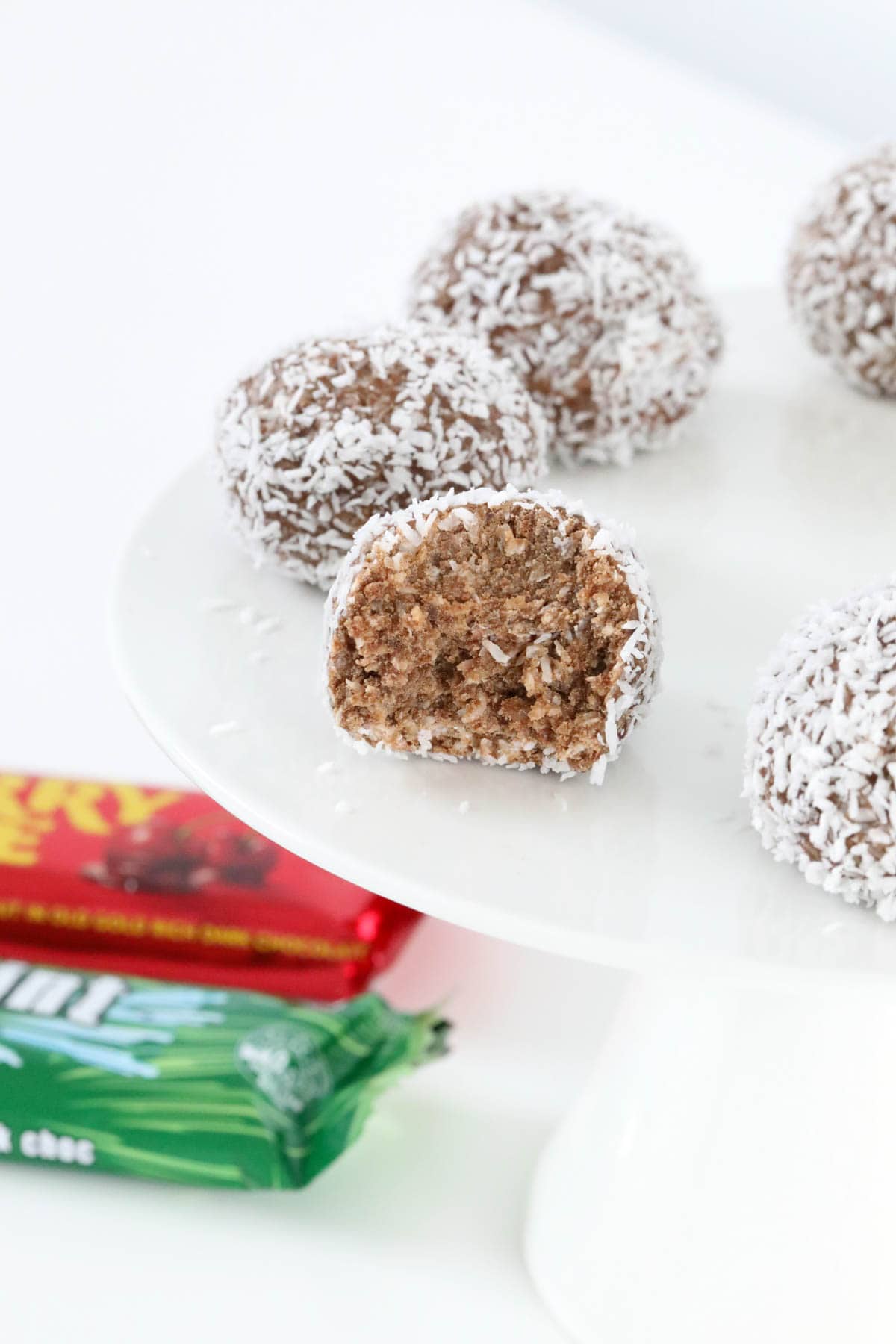 A half eaten chocolate coconut ball.