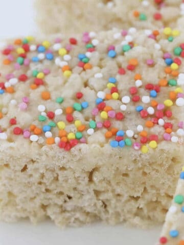 Sprinkles on top of rice krispie slice.