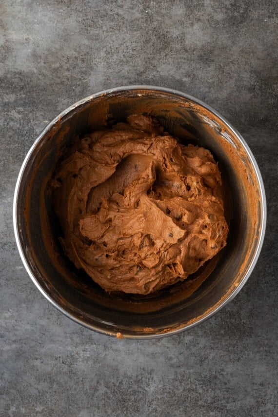 Double chocolate mint cookie dough in a metal mixing bowl.