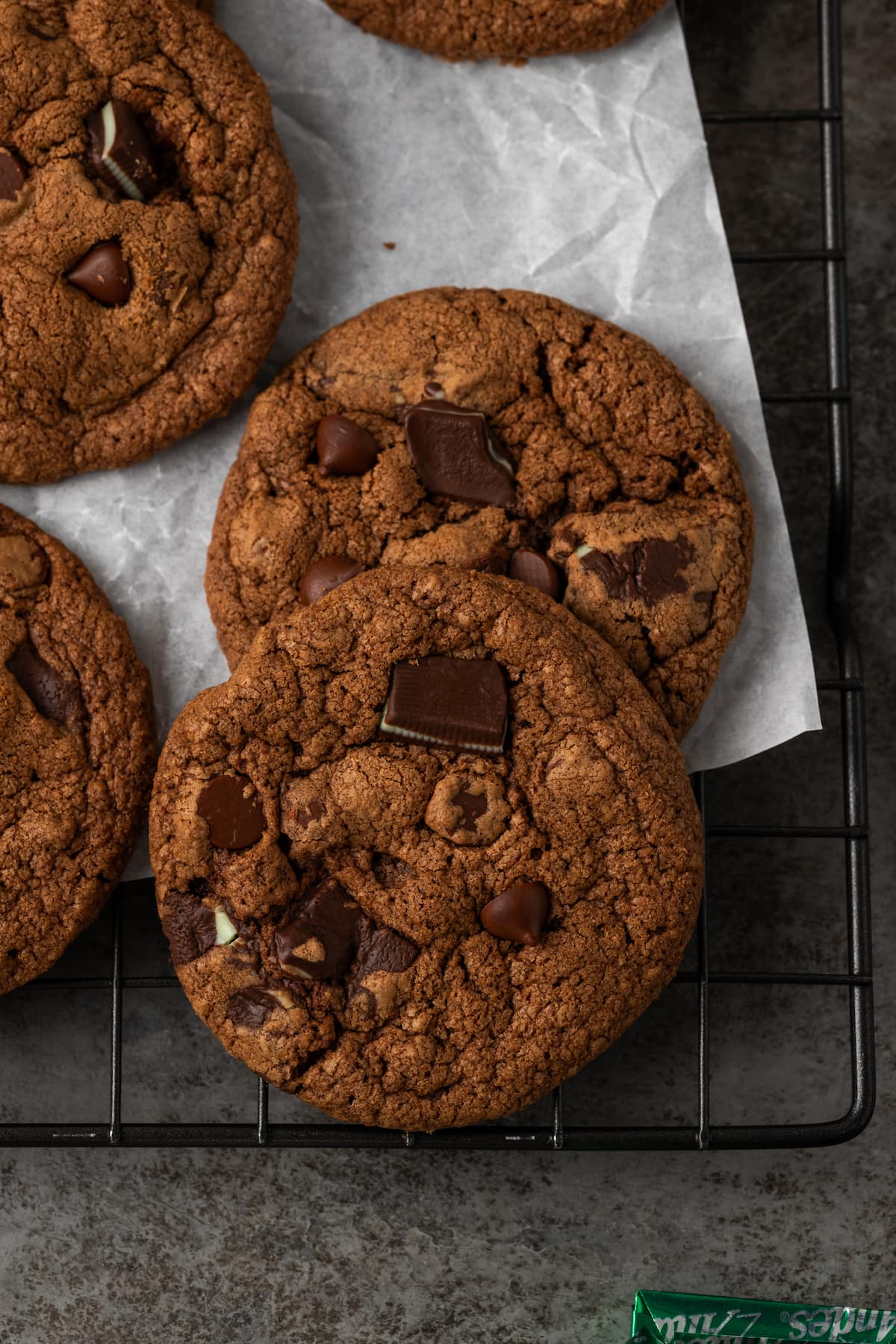 Overhead view of double chocolate mint cookies on a wire rack.
