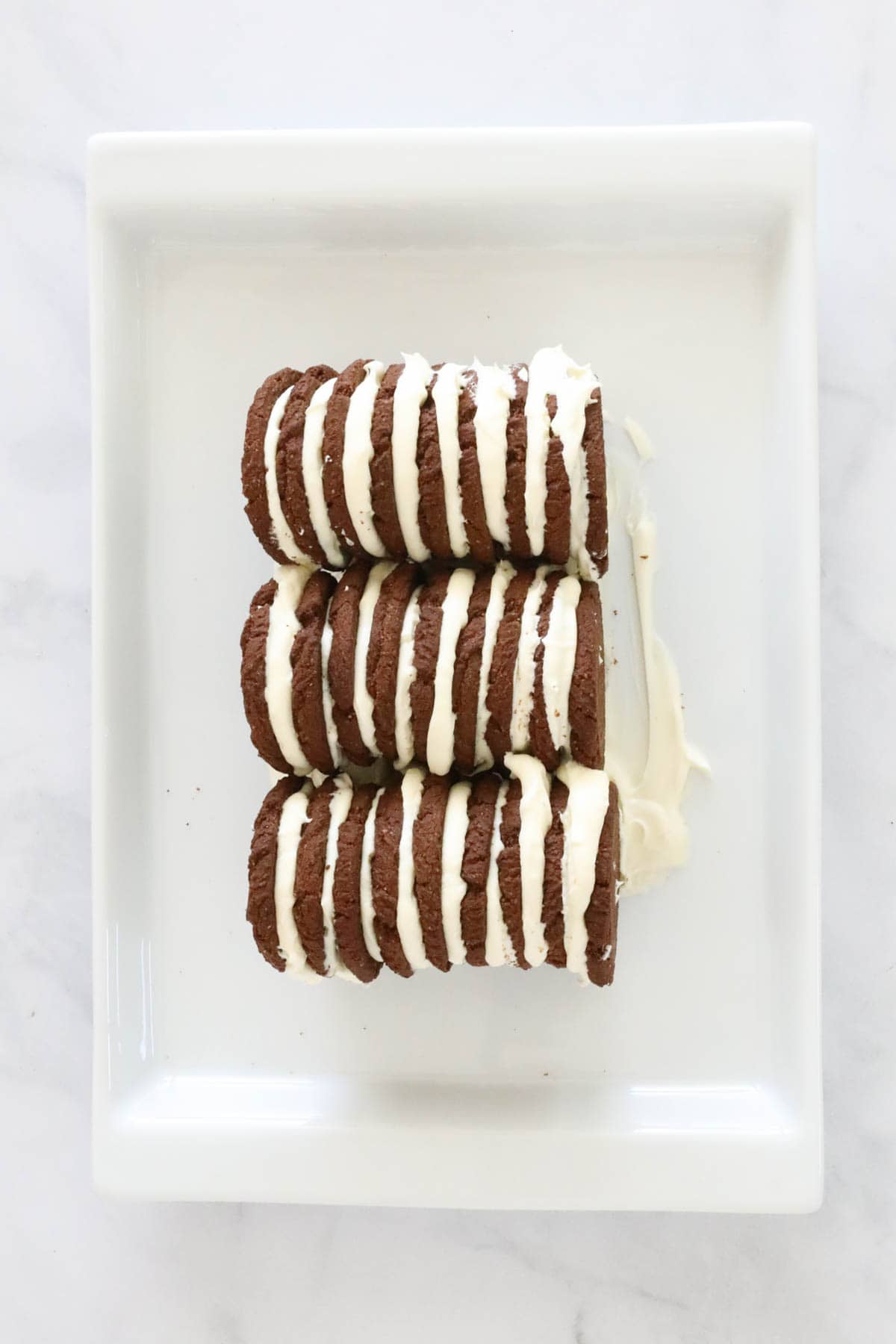 Choc ripple bsicuits and cream on a plate.