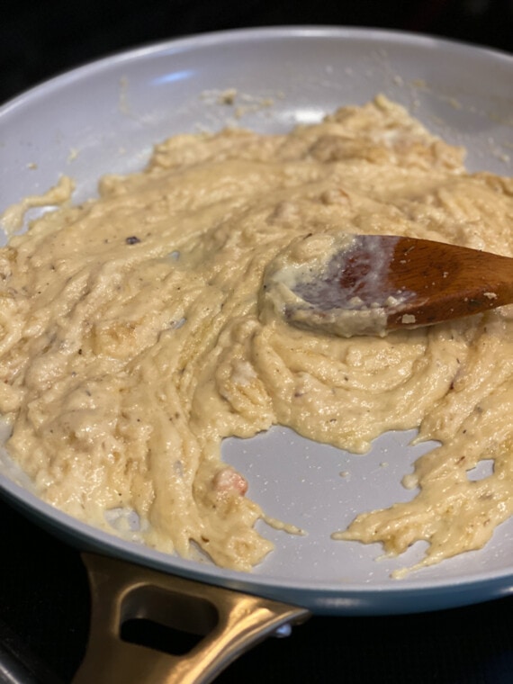 Cooking a roux in a skillet with a wooden spoon