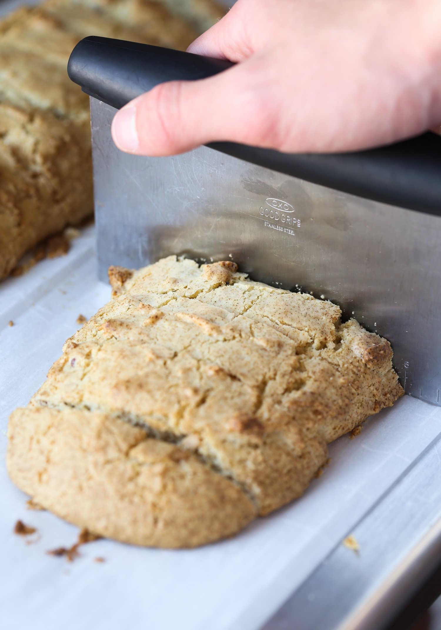 This classic Italian Biscotti recipe is super easy to make and totally customizable! Add sliced almonds or dip them in chocolate! Biscotti loaf being sliced.