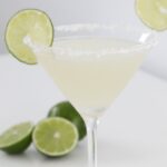 A martini glass filled with margarita.