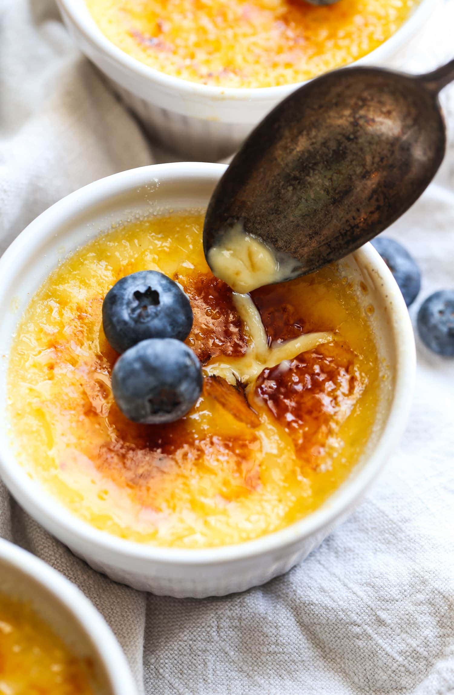 Creme Brûlée in a ramekin with the sugar broken
